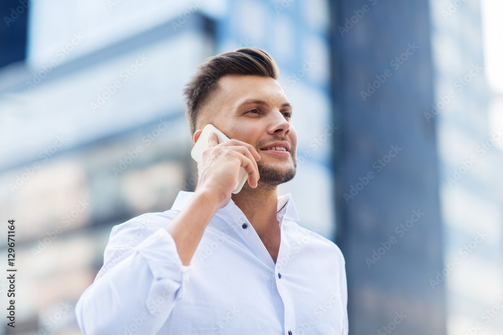 happy man with smartphone calling on city street happy man with smartphone calling on city street