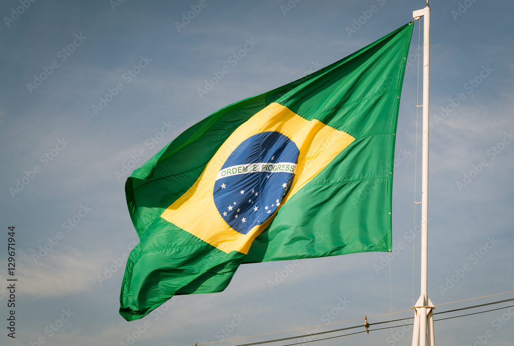 Flag of Brazil hoisted. Brazilian flag waving with the wind. Stock Photo