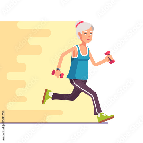 Fit elderly woman jogging with dumbbells