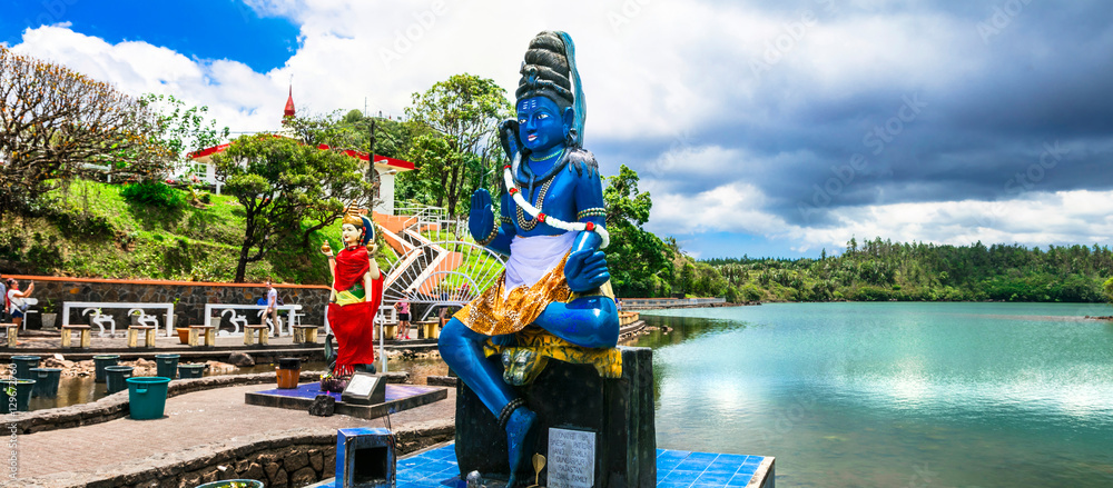 Fototapeta premium Mauritius Grand Bassin Ganga Talao 8K panorama. Hindu temple and sacred lake with Shiva statues in volcanic crater. Religious culture landmark. World Print 80000px travel exotic scenery