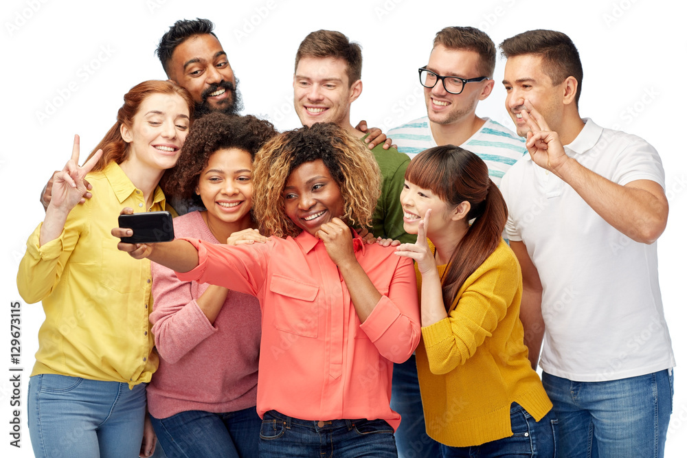 Fototapeta premium group of people taking selfie by smartphone