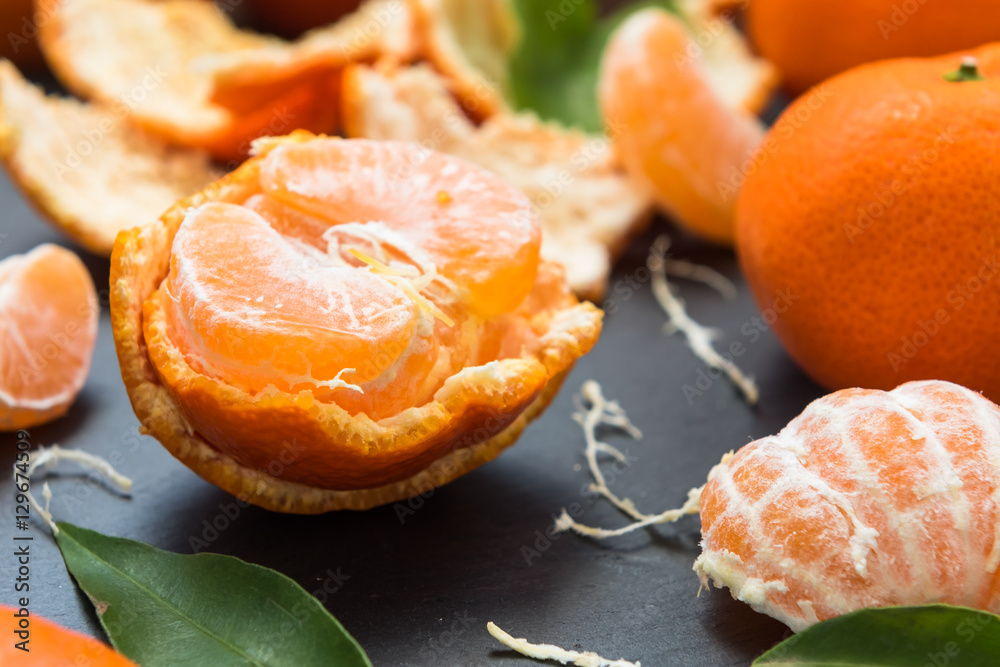 Ripe mandarin with leaves on a table Ripe mandarin with leaves on a table