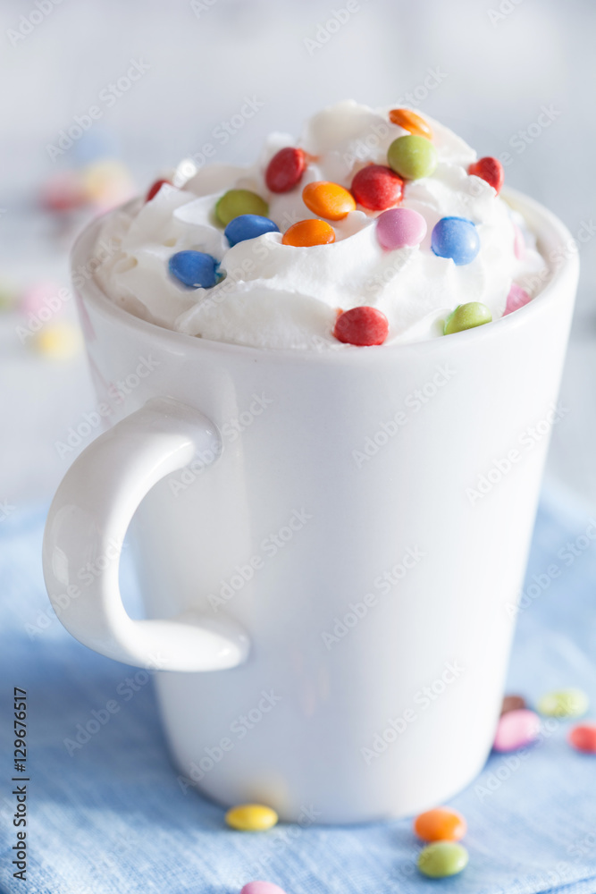 coffee with whipped cream and colorful chocolate drops coffee with whipped cream and colorful chocolate drops