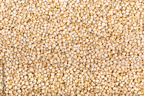 A background of white Chenopodium quinoa seeds, a superfood high in protein and fibre. 