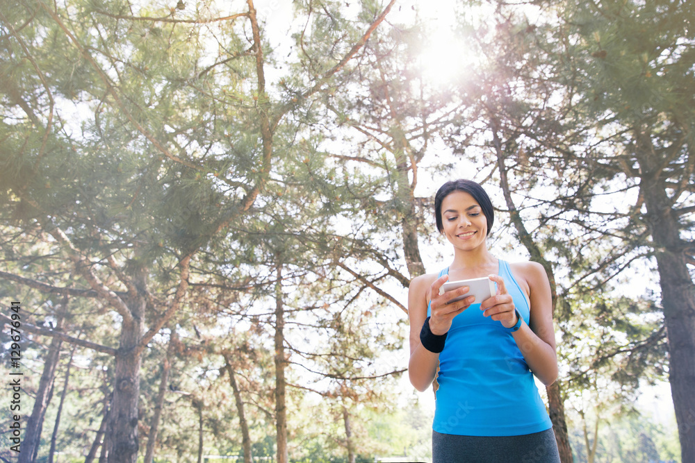 Sporty woman using smartphone Sporty woman using smartphone