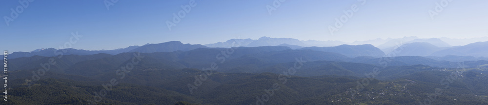 Panoramic views of the Caucasus Mountains with an observation tower on the mountain Big Ahun, Krasnodar region, Russia