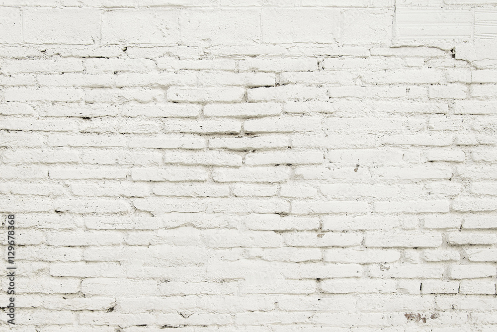 Old brick wall with white paint background texture Old brick wall with white paint background texture