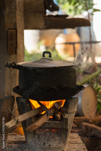 Old pot standing on wood burning stove