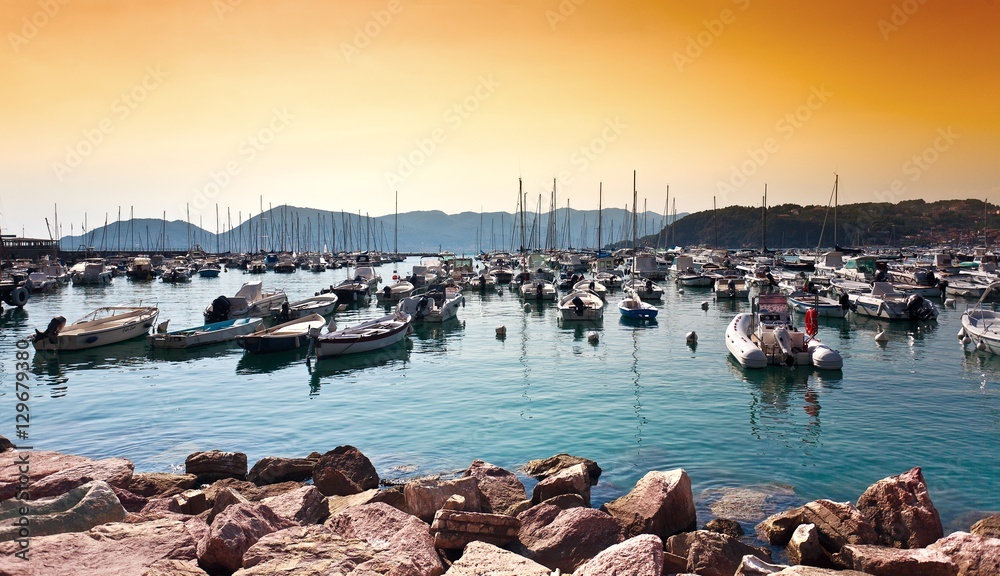 Beautiful sunset above many yachts in Mediterranean sea in Lerici