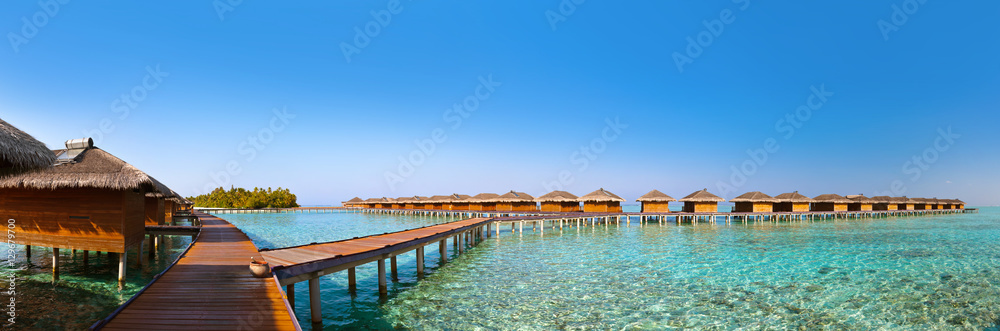 Bungalows on tropical Maldives island