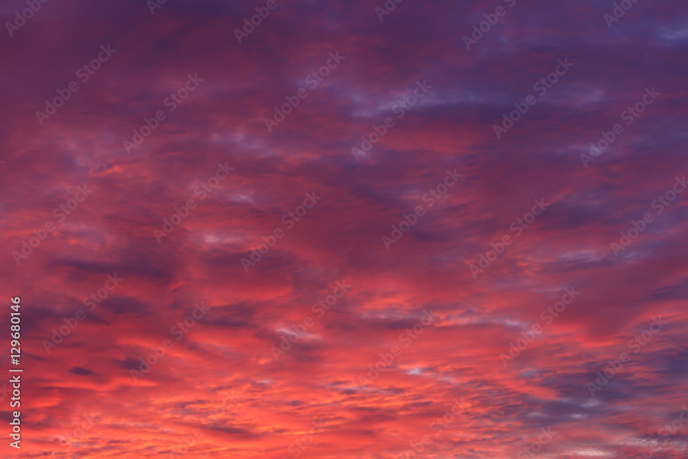 Sunset cloudly sky red purple background