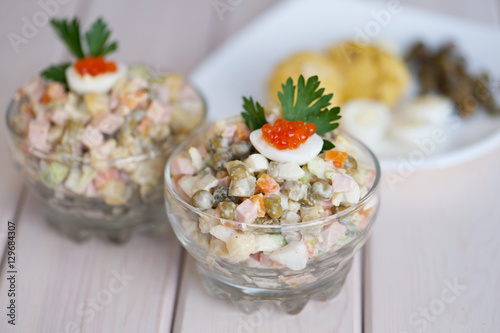 Glass dish with olivier salad, gorizontal shot