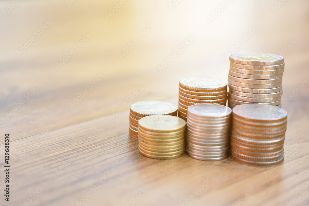 Hand holding coin on old wood tree bokeh background.concept save money Hand holding coin on old wood tree bokeh background.concept save money