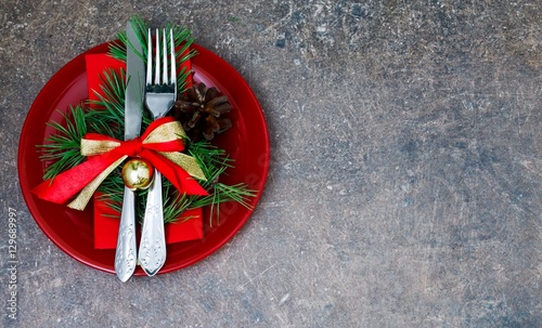 Christmas setting with festive decorations on a dark background with a copy of the table space.