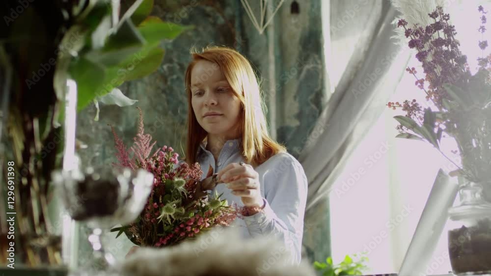 woman looking at a bouquet woman looking at a bouquet