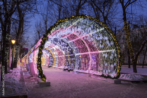 Christmas night on Tverskoy Boulevard in Moscow. Glowing decorative tunnel photo