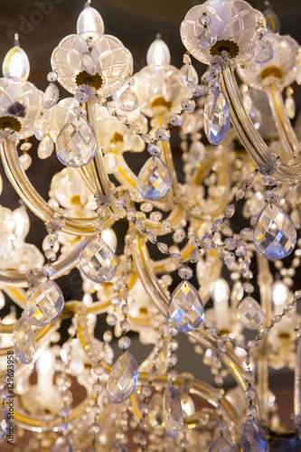 close up on ancient crystal chandelier © Melanie