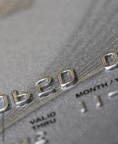 Closeup shot of a credit card. Numbers and validity partly visible