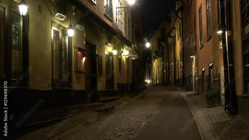 Ancient narrow street in central Stockholm. Old town. 4K. Night, lights
Ancient narrow street in central Stockholm. Old town. 4K. Night, lights
