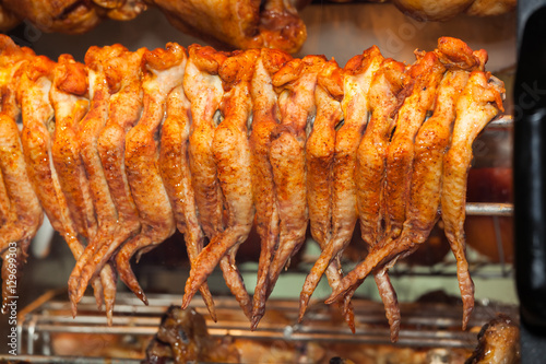 Grilled chicken in oven close up view photo