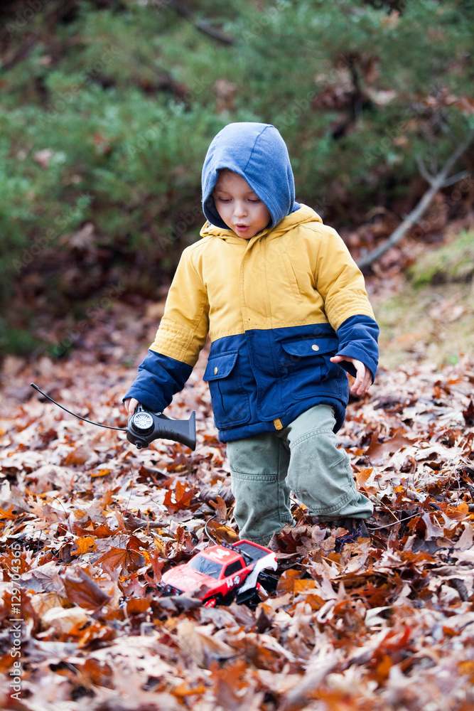 A child play with the radio control car outdoor A child play with the radio control car outdoor