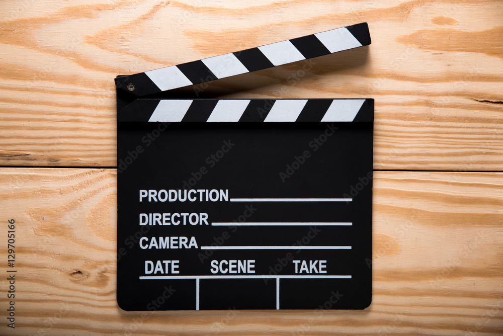 Obraz premium Clapper board,Movie clapper on wood backgrond