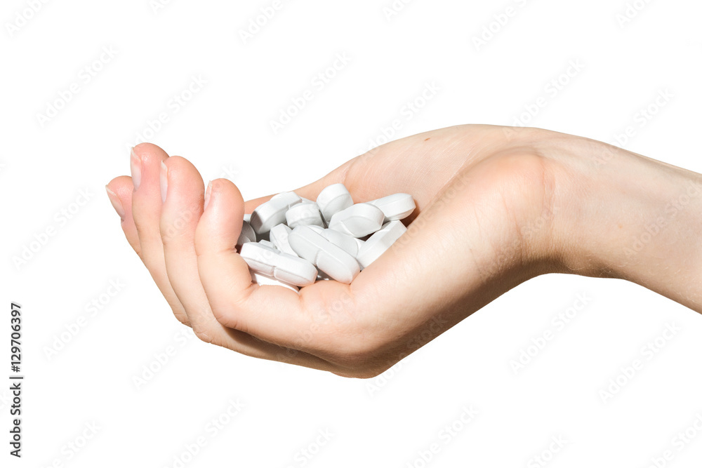 white pills in a cupped hand, isolated white pills in a cupped hand, isolated