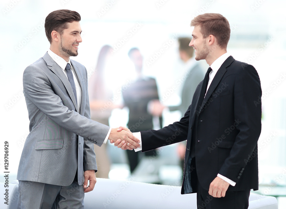 Business people shaking hands during a meeting Business people shaking hands during a meeting