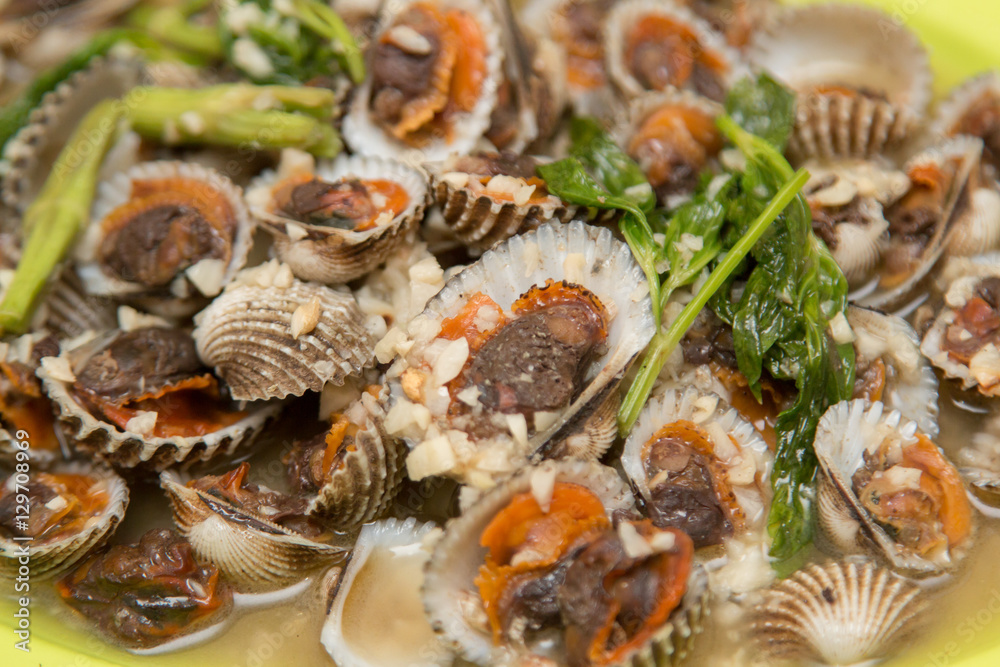 Scallops mussels baked with butter and garlic in shell Scallops mussels baked with butter and garlic in shell