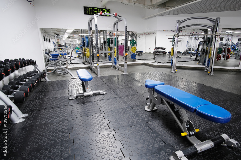 Fototapeta premium Interior of a fitness hall with fitness equipment