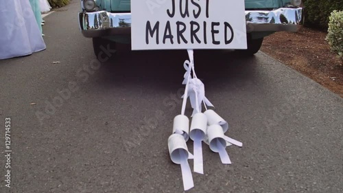 Just married car with cans in slow motion