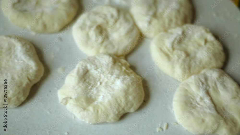 Ingredients. Flour and dough. Preparation of belyashes. Traditional russian meat pies belyashi. belyashes on a table. Russian, Bashkir and Tatar cuisine. Ingredients. Flour and dough. Preparation of belyashes. Traditional russian meat pies belyashi. belyashes on a table. Russian, Bashkir and Tatar cuisine.