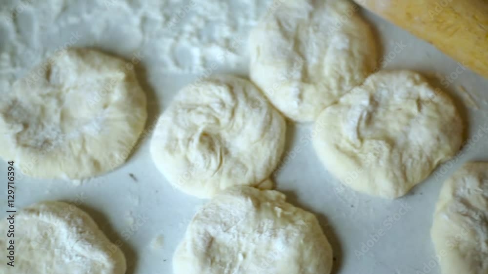 Preparation of belyashes. Traditional russian meat pies belyashi. belyashes on a table. Russian, Bashkir and Tatar cuisine. Preparation of belyashes. Traditional russian meat pies belyashi. belyashes on a table. Russian, Bashkir and Tatar cuisine.