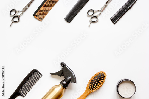 Canvas Print combs and hairdresser tools on white background top view
