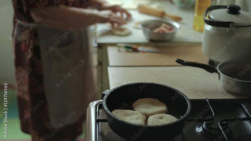 Preparation of belyashes. Traditional russian meat pies belyashi. belyashes on a table. Russian, Bashkir and Tatar cuisine. Preparation of belyashes. Traditional russian meat pies belyashi. belyashes on a table. Russian, Bashkir and Tatar cuisine.