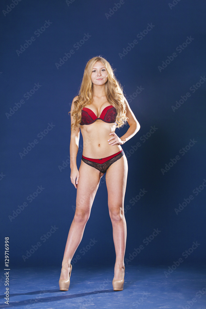Fototapeta premium Full portrait of sexy lady in red underwear