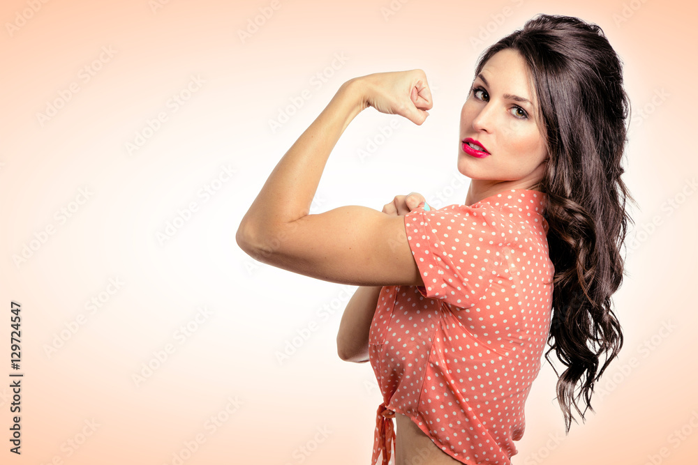 Close up vintage powerful confident pin up girl strong flexing