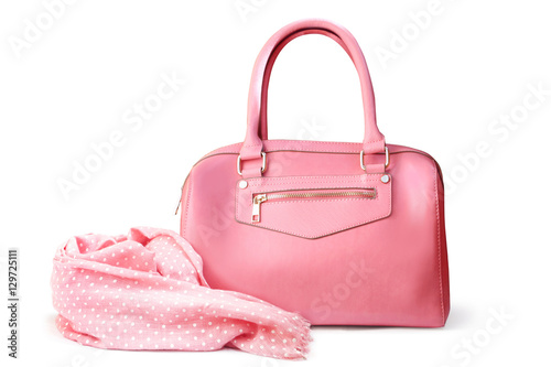 Stylish women's accessories. Beautiful set of women's handbag and scarf on a white background. Light pink, light coral