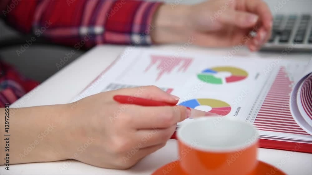 Accountant Woman Carries Out An Audit Of Quarterly Report Accountant Woman Carries Out An Audit Of Quarterly Report