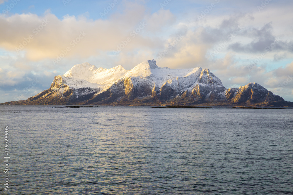 View of a Norwegian fjord with snowy mountains, Nordland, Norway View of a Norwegian fjord with snowy mountains, Nordland, Norway