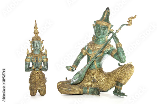 Traditional Thai bronze statues isolated against a white background. Musician and Temple Guardian.