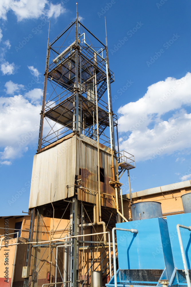 Vertical photo in color of an old industrial boiler