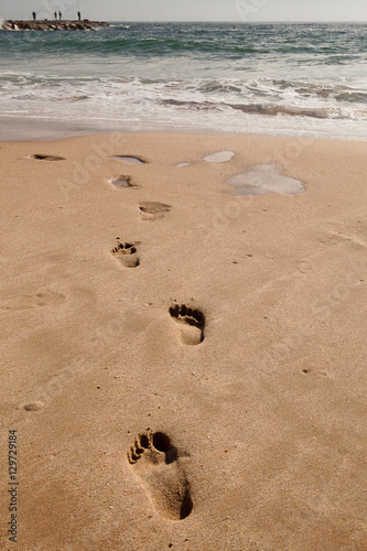 Footprints in the sand, at the beach, Cova do Vapor, Portugal