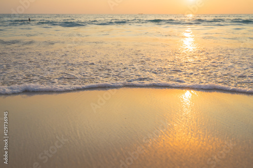 Golden sunrise sunset over the sea ocean waves