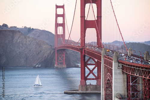 Close up golden gate bridge in san francisco,boat on the ocean photo