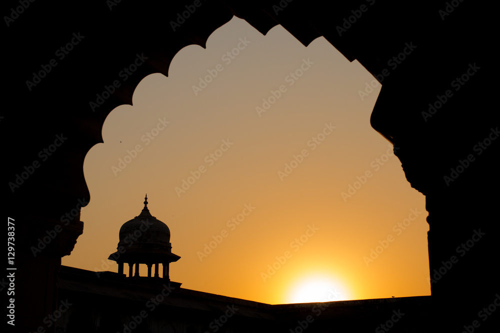 Silhouette of the walls famous red fort tower dome Agra Fort in Uttar Predesh, India.