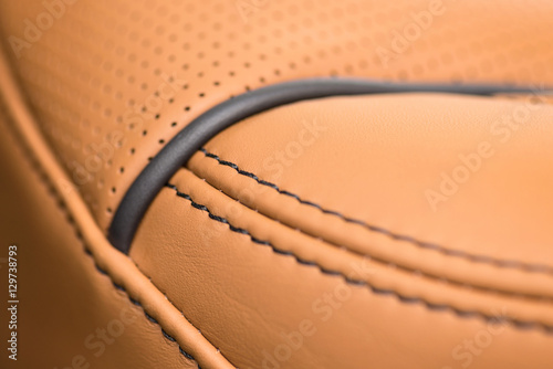 Part of leather car seat with stich. Macro.
