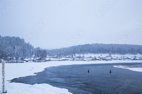 Winter. Fishermen in a boat. © trofimov_pavel