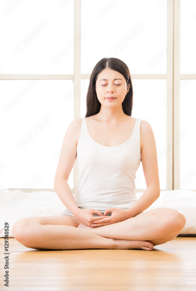 asian woman meditating zen in morning beside bed asian woman meditating zen in morning beside bed
