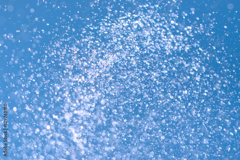 Obraz premium drops of water on a blue background